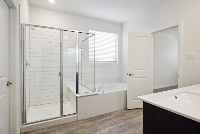 2929 Log Cabin Dr, Celina, TX 75009 - full bath with a garden tub, a shower stall, vanity, and wood tiled floors