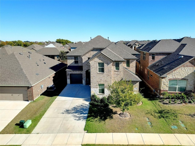 2929 Log Cabin Dr, Celina, TX 75009 - french country style house with driveway, a residential view, brick siding, and stone siding