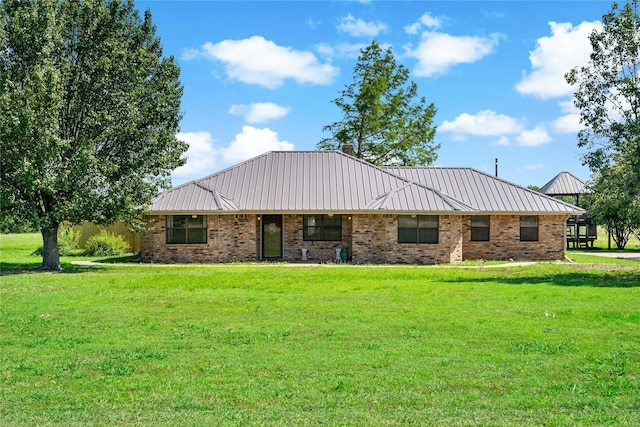4395 Farm Rd Unit 2820, Sumner, TX 75486 - ranch-style house featuring a front lawn, metal roof, and brick siding