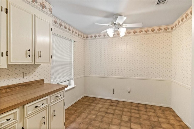 1506 Ridgeview Dr, Arlington, TX 76012 - unfurnished dining area with ceiling fan, wallpapered walls, and baseboards