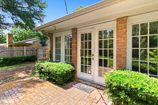1506 Ridgeview Dr, Arlington, TX 76012 - property entrance with french doors, a patio, and brick siding