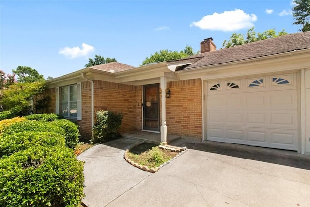 1506 Ridgeview Dr, Arlington, TX 76012 - doorway to property featuring a garage, a chimney, brick siding, and asphalt driveway
