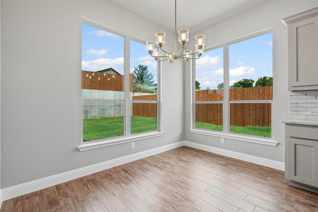 207 Mitchell Dr, Glen Rose, TX 76043 - unfurnished dining area featuring a chandelier and wood finished floors