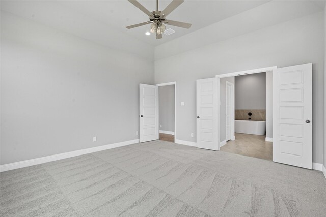 207 Mitchell Dr, Glen Rose, TX 76043 - unfurnished bedroom featuring carpet, a high ceiling, ensuite bathroom, and a ceiling fan