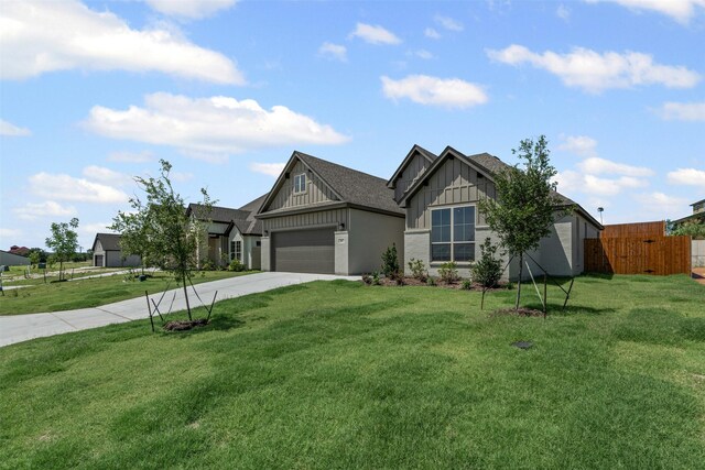 207 Mitchell Dr, Glen Rose, TX 76043 - view of front of home with board and batten siding, driveway, a garage, and a shingled roof