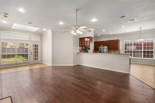 3616 Canyon Oaks Dr, Carrollton, TX 75007 - unfurnished living room featuring ornamental molding, a chandelier, dark wood-type flooring, recessed lighting, and ceiling fan