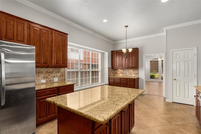 3616 Canyon Oaks Dr, Carrollton, TX 75007 - kitchen featuring freestanding refrigerator, crown molding, tasteful backsplash, pendant lighting, and light stone counters