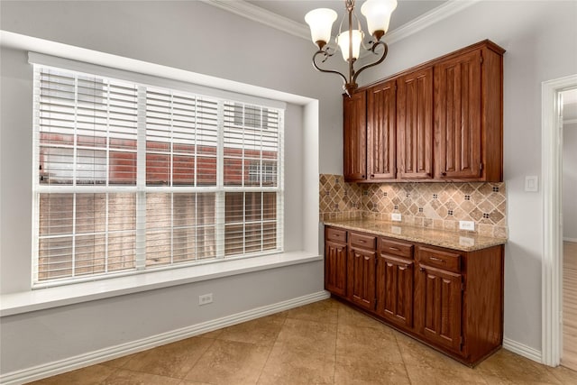 3616 Canyon Oaks Dr, Carrollton, TX 75007 - kitchen with a chandelier, crown molding, tasteful backsplash, light tile patterned floors, and light stone counters