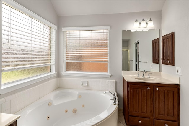 3616 Canyon Oaks Dr, Carrollton, TX 75007 - bathroom with vanity, a stall shower, a jetted tub, and vaulted ceiling