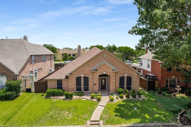 3616 Canyon Oaks Dr, Carrollton, TX 75007 - traditional-style house featuring brick siding and a residential view