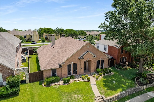 3616 Canyon Oaks Dr, Carrollton, TX 75007 - traditional-style home with a residential view, brick siding, and a chimney