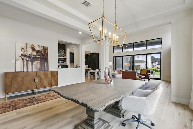 5901 Westworth Falls Way, Westworth Village, TX 76114 - dining space with wood finished floors, a chandelier, a high ceiling, and recessed lighting