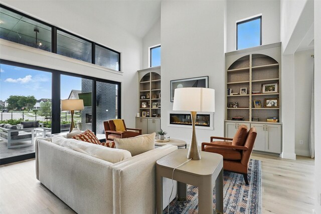 5901 Westworth Falls Way, Westworth Village, TX 76114 - living room with a high ceiling and light wood-style floors