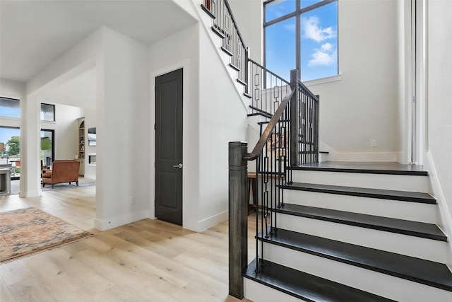 5901 Westworth Falls Way, Westworth Village, TX 76114 - stairs featuring plenty of natural light, wood finished floors, and baseboards