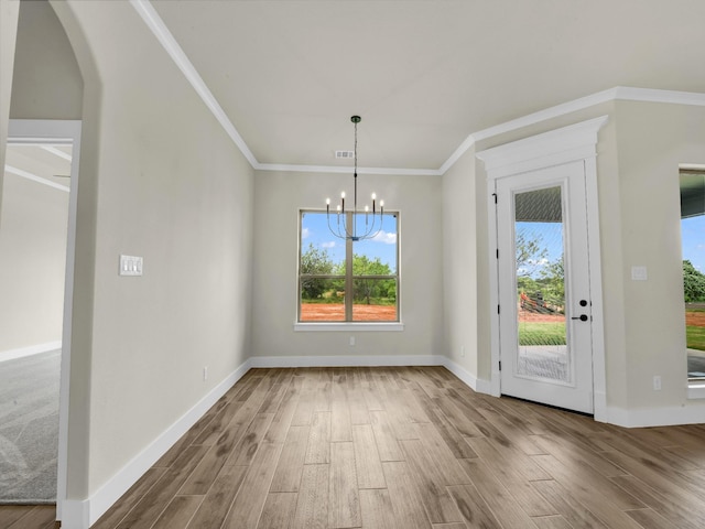 971 County Road 1304, Bridgeport, TX 76426 - unfurnished dining area featuring wood finished floors, a chandelier, plenty of natural light, and ornamental molding