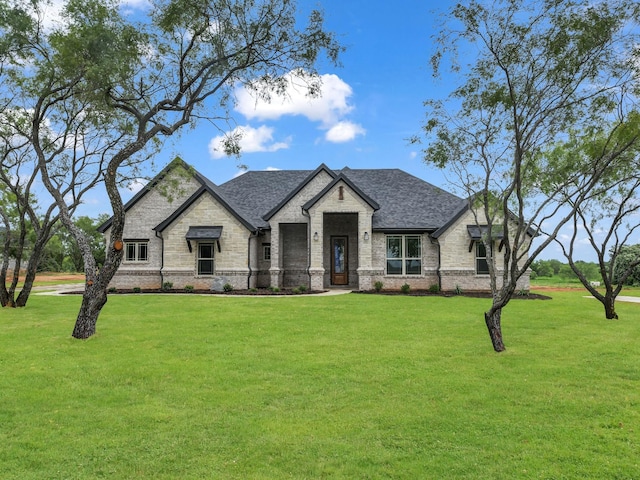 971 County Road 1304, Bridgeport, TX 76426 - french country inspired facade featuring a front yard, brick siding, and roof with shingles