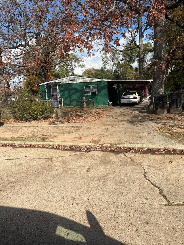 4814 Mcdaniel Dr, Shreveport, LA 71109 - view of outdoor structure featuring concrete driveway and an attached carport