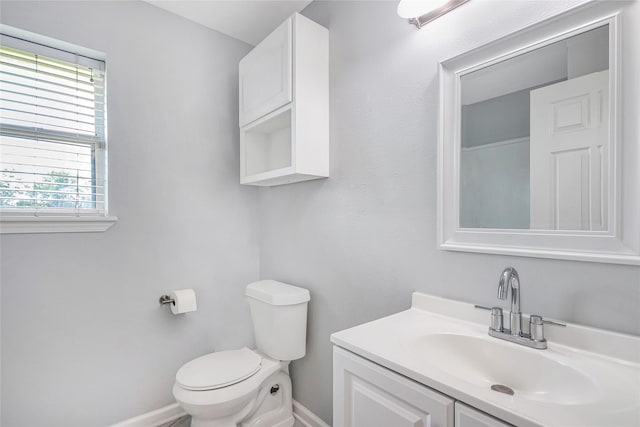 5718 Gloucester Dr, Tyler, TX 75707 - half bath with baseboards, toilet, and vanity