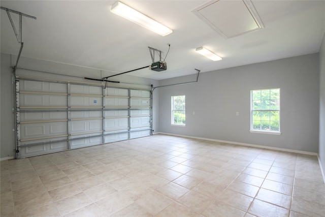 5718 Gloucester Dr, Tyler, TX 75707 - garage with a garage door opener and baseboards