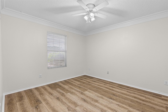 1458 Foxwood Ln, Rockwall, TX 75032 - empty room with ornamental molding, wood finished floors, a textured ceiling, a ceiling fan, and baseboards
