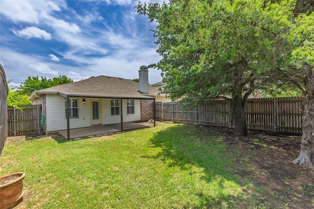 1458 Foxwood Ln, Rockwall, TX 75032 - back of property featuring a patio area and a chimney