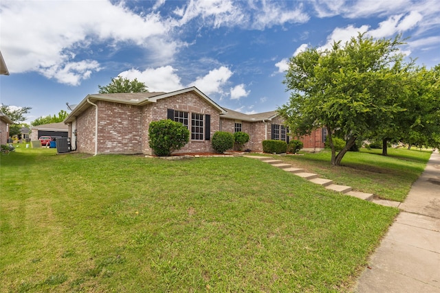 1458 Foxwood Ln, Rockwall, TX 75032 - ranch-style house featuring brick siding, central air condition unit, and a front lawn