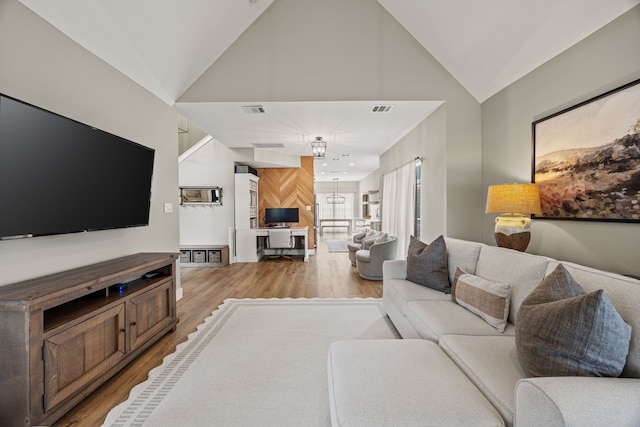 8620 Quail Meadow Dr, Irving, TX 75063 - living area featuring light wood-style floors and high vaulted ceiling