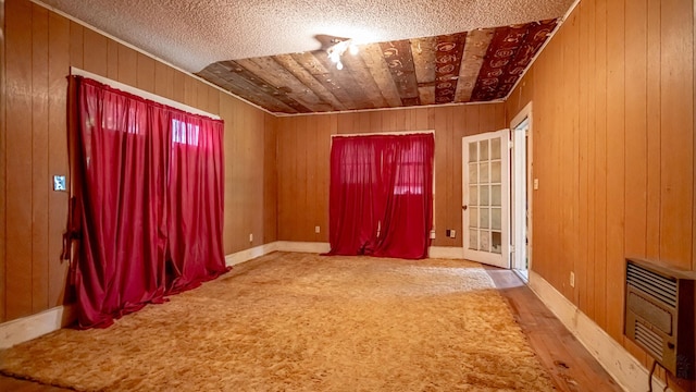 224 Pecan St, Dublin, TX 76446 - spare room with heating unit and wooden walls