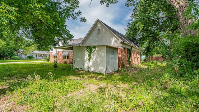 224 Pecan St, Dublin, TX 76446 - view of side of home featuring brick siding
