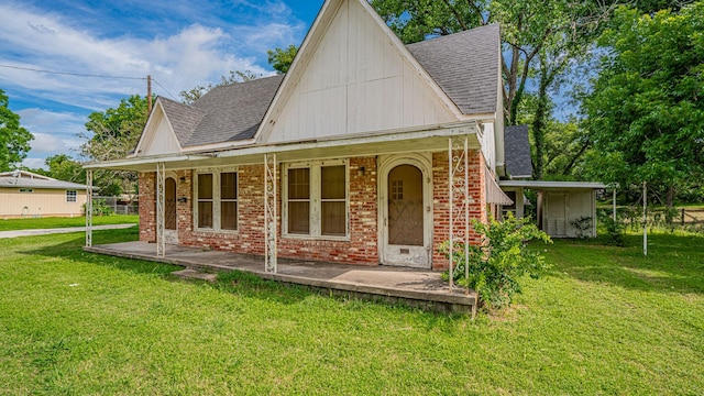 224 Pecan St, Dublin, TX 76446 - rear view of house with roof with shingles, brick siding, and a lawn