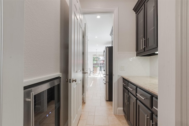 8008 Craftsbury Ln, Mckinney, TX 75071 - hallway with beverage cooler and recessed lighting