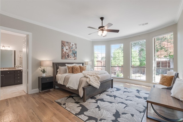 8008 Craftsbury Ln, Mckinney, TX 75071 - bedroom featuring multiple windows, light wood-style flooring, crown molding, connected bathroom, and a ceiling fan