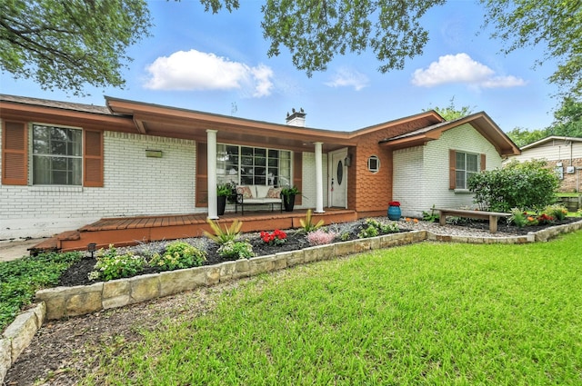 1700 N Preston St, Ennis, TX 75119 - single story home with brick siding, a front yard, a porch, and a chimney