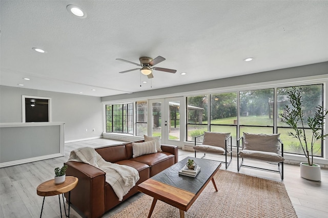 1700 N Preston St, Ennis, TX 75119 - living room with wood finished floors, french doors, ceiling fan, and recessed lighting
