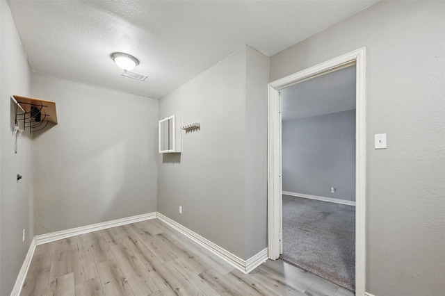 1700 N Preston St, Ennis, TX 75119 - washroom with light wood-style floors