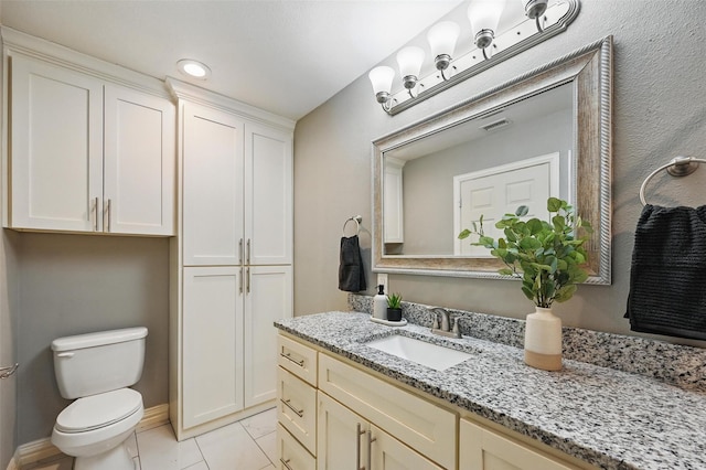 1700 N Preston St, Ennis, TX 75119 - bathroom with vanity and tile patterned flooring