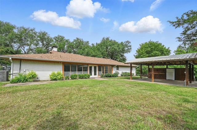 1700 N Preston St, Ennis, TX 75119 - view of front of house featuring french doors, a chimney, and a front lawn