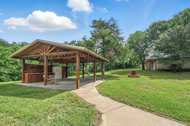 1700 N Preston St, Ennis, TX 75119 - view of property's community featuring a gazebo, a yard, and a patio area