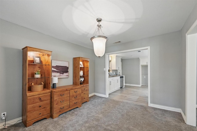 1700 N Preston St, Ennis, TX 75119 - living area featuring light colored carpet and baseboards
