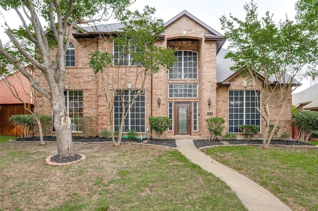3612 Waynoka Dr, Carrollton, TX 75007 - traditional-style house featuring brick siding and a front lawn