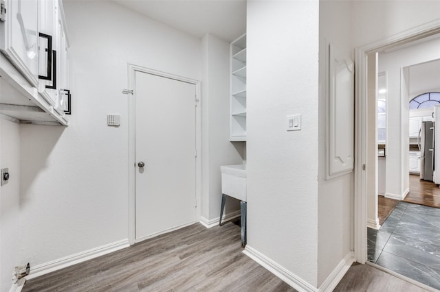 3612 Waynoka Dr, Carrollton, TX 75007 - washroom featuring cabinet space, wood finished floors, hookup for an electric dryer, and baseboards