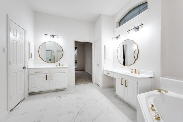 3612 Waynoka Dr, Carrollton, TX 75007 - full bathroom featuring marble look tile flooring, a bath, and two vanities