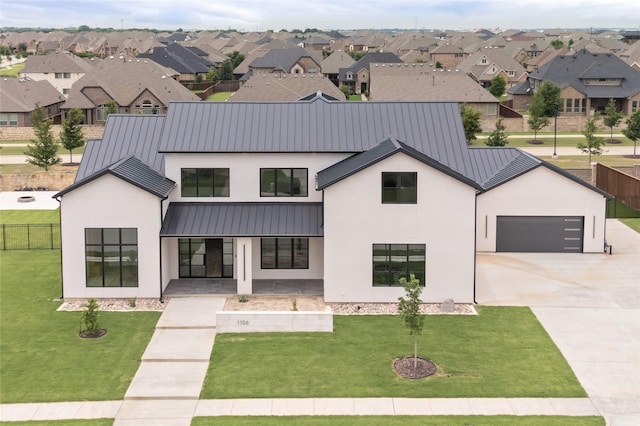 1106 Knoll Crest Dr, Mansfield, TX 76063 - view of front facade with a standing seam roof, stucco siding, a porch, metal roof, and driveway