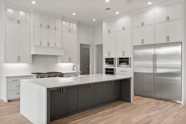 1106 Knoll Crest Dr, Mansfield, TX 76063 - kitchen featuring built in fridge, light wood-style flooring, white cabinets, recessed lighting, and a sink