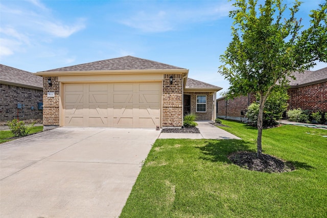 7668 Monument Dr, Little Elm, TX 76227 - view of front of home with brick siding, an attached garage, driveway, and a front yard