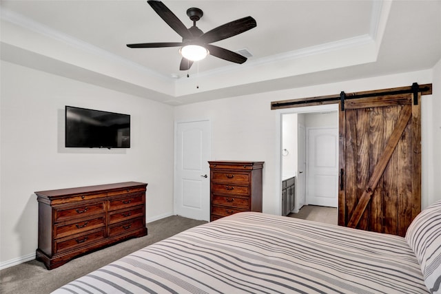 7668 Monument Dr, Little Elm, TX 76227 - bedroom with carpet floors, a tray ceiling, ornamental molding, a barn door, and ceiling fan