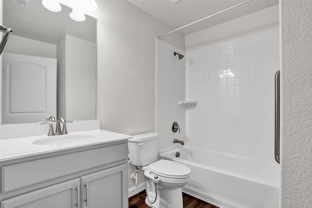 7668 Monument Dr, Little Elm, TX 76227 - full bath with wood finished floors, a textured wall, vanity, and shower / bathtub combination