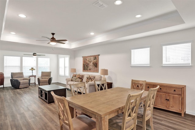7668 Monument Dr, Little Elm, TX 76227 - dining room featuring a tray ceiling, ornamental molding, ceiling fan, wood finished floors, and recessed lighting