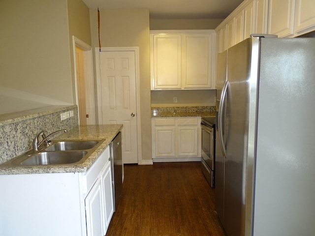 2013 Alanbrooke Dr, Fort Worth, TX 76140 - kitchen featuring appliances with stainless steel finishes, a sink, dark wood-style floors, and white cabinets