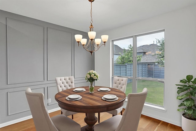 545 Oakmoss St, Little Elm, TX 76227 - dining room with a chandelier and light wood-style flooring